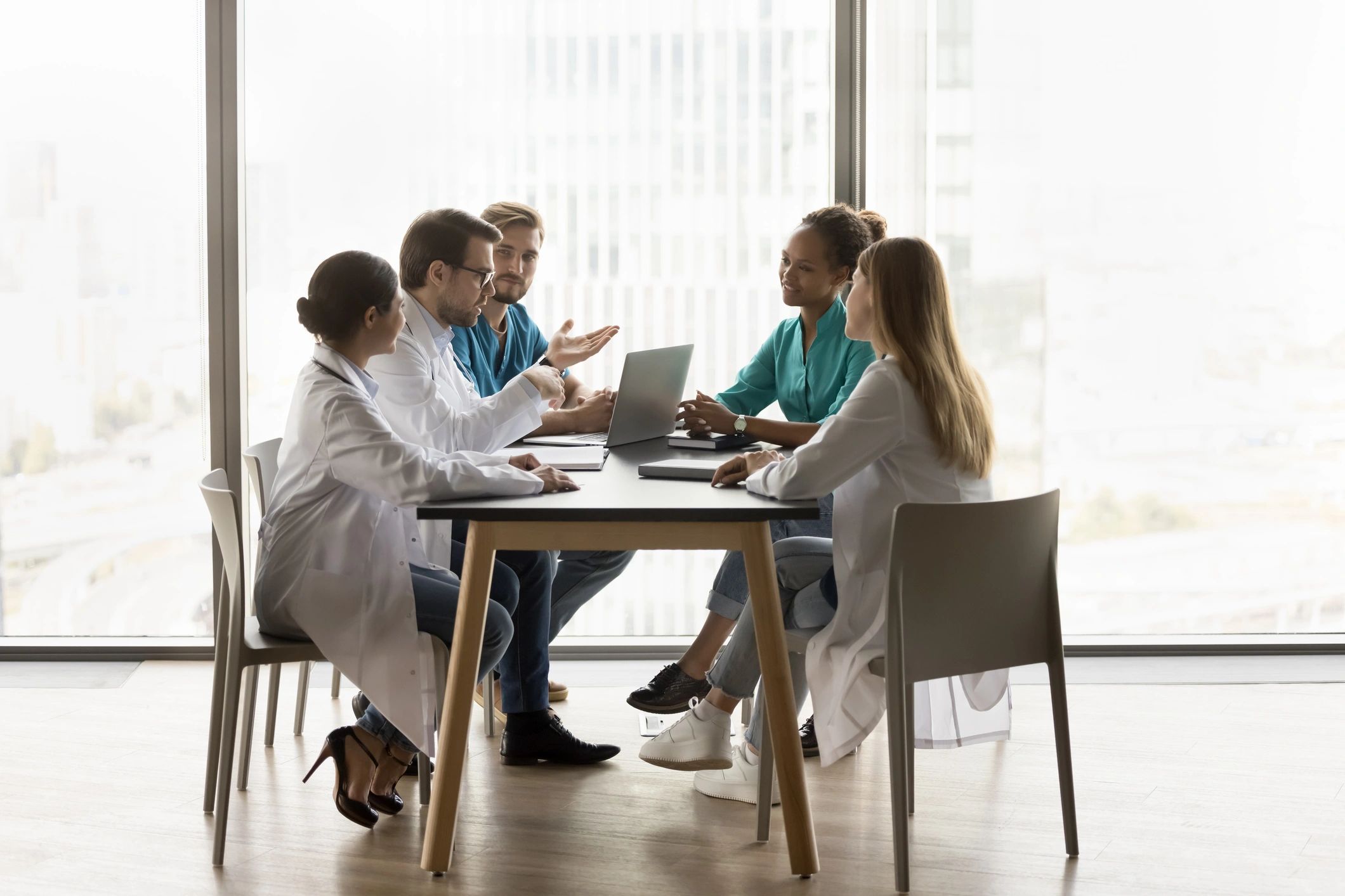 Healthcare professionals collaborating around a table