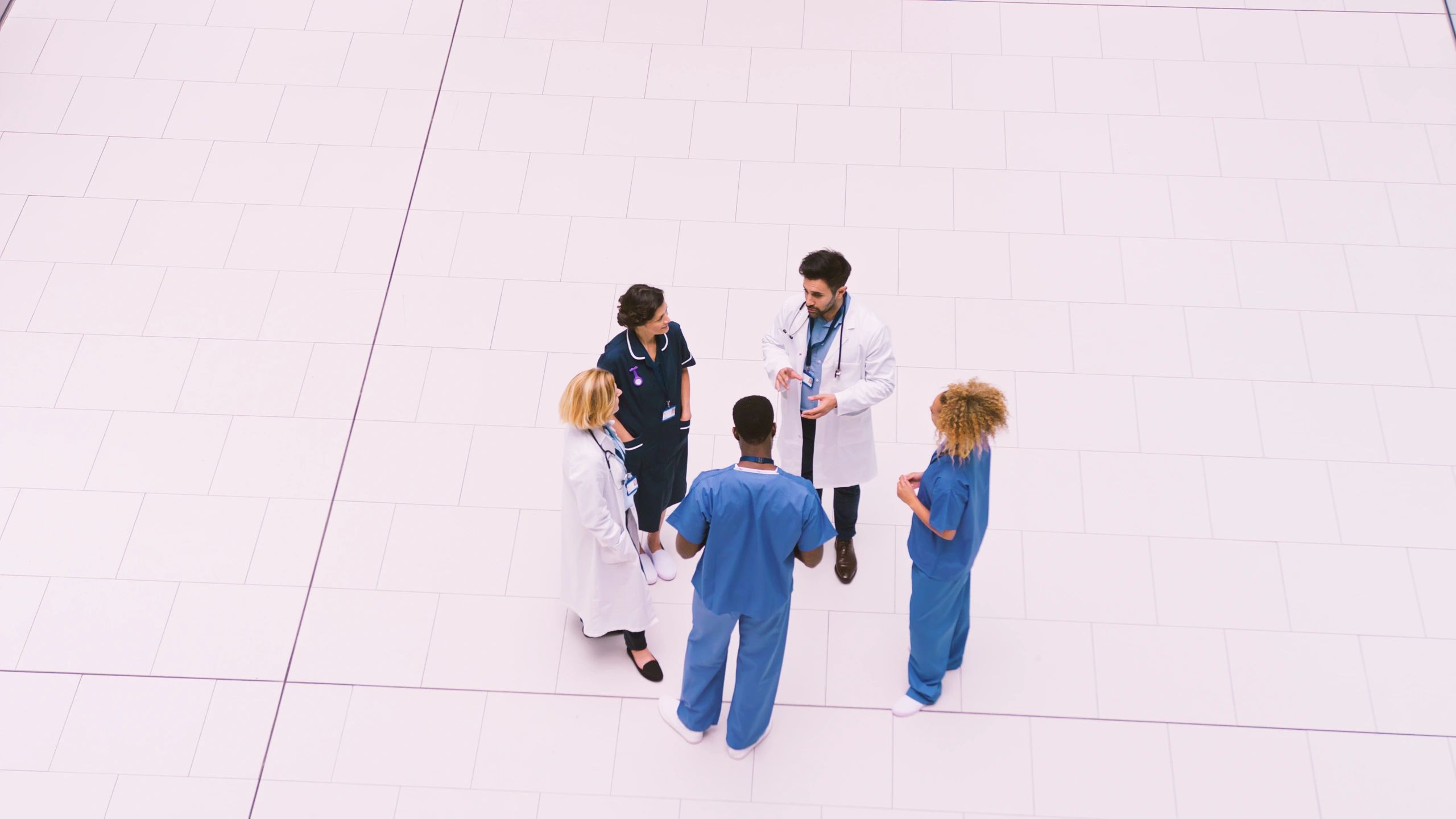 Healthcare staff in a modern hospital meeting area